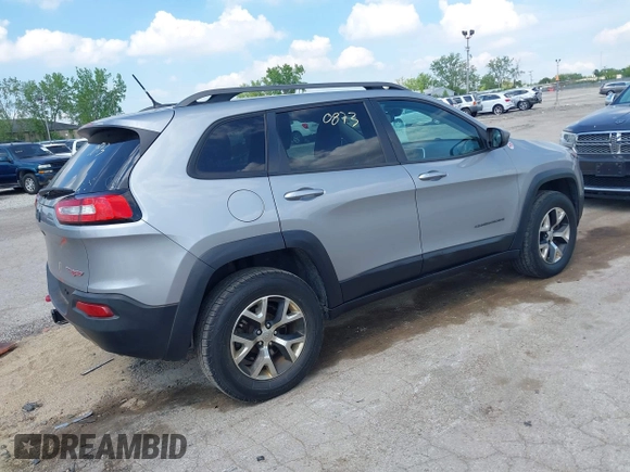 2015 Jeep Cherokee Trailhawk z VIN 1C4PJMBS5FW615313, wystawiony jako IAAI lot #42250873 z przebiegiem 148 008 mil mil oraz . Historia ofert i sprzedaży dostępna na DreamBid. Obrazek 4.