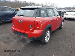 2013 MINI Cooper Countryman with VIN WMWZB3C57DWM07565, listed as a IAAI auction lot 41655938 with 62,694 mi miles. Bid and sale history available at carsss.com. Image 4.