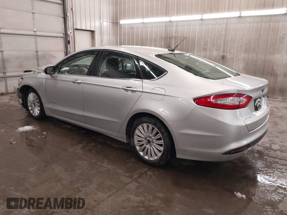 2016 Ford Fusion SE Hybrid z VIN 3FA6P0LU1GR304166, wystawiony jako IAAI lot #41932720 z przebiegiem 68 058 mil mil oraz . Historia ofert i sprzedaży dostępna na DreamBid. Obrazek 3.