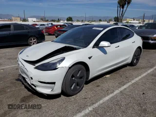2023 Tesla Model 3 with VIN 5YJ3E1EA9PF401418, listed as a Copart auction lot 50597015 with 79,673 mi miles and Salvage Title. Bid and sale history available at DreamBid. Image 1.