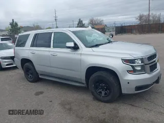 2015 Chevrolet Tahoe Commercial z VIN 1GNSK2ECXFR681555, wystawiony jako IAAI lot #41975359 z przebiegiem 126 785 mil mil oraz . Historia ofert i sprzedaży dostępna na DreamBid. Obrazek 1.