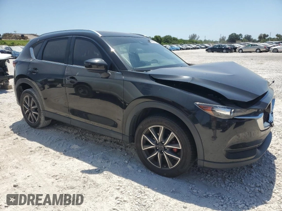 2018 Mazda CX-5 Touring with VIN JM3KFACM2J1327725, listed as a Copart auction lot 54894765 with 56,194 mi miles and Salvage Title. Bid and sale history available at carsss.com. Image 4.