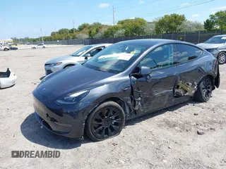 2024 Tesla Model Y with VIN 7SAYGDED3RF019063, listed as a IAAI auction lot 42061888 with 13,763 mi miles and . Bid and sale history available at DreamBid. Image 2.