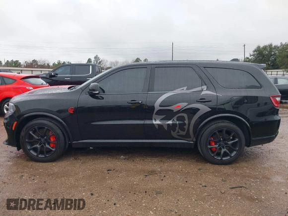 2023 Dodge Durango SRT Hellcat Premium with VIN 1C4SDJH99PC584770, listed as a IAAI auction lot 41562157 with 14,598 mi miles and . Bid and sale history available at DreamBid. Image 14.