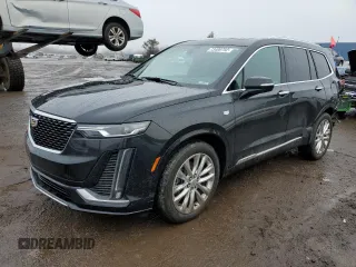 2021 Cadillac XT6 Premium Luxury z VIN 1GYKPDRS8MZ103159, wystawiony jako Copart lot #73400792 z przebiegiem 54 365 mil mil oraz . Historia ofert i sprzedaży dostępna na DreamBid. Obrazek 1.