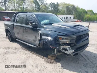 2022 Ram 1500 TRX with VIN 1C6SRFU98NN272629, listed as a IAAI auction lot 42043877 with 26,900 mi miles and . Bid and sale history available at DreamBid. Image 1.