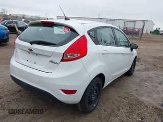 2013 Ford Fiesta SE with VIN 3FADP4EJ8DM193710, listed as a IAAI auction lot 42020003 with 95,625 mi miles. Bid and sale history available at carsss.com. Image 4.