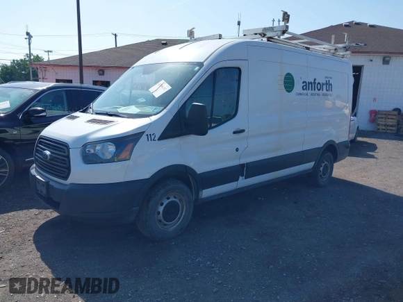 2015 Ford Transit Cargo with VIN 1FTNE2CM4FKA29323, listed as a IAAI auction lot 42406192 with 156,493 mi miles and . Bid and sale history available at DreamBid. Image 2.