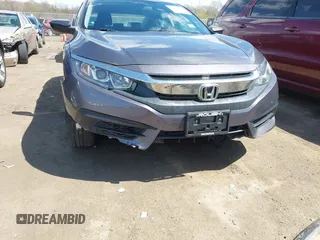 2018 Honda Civic LX with VIN 2HGFC2F5XJH586527, listed as a IAAI auction lot 42080372 with 52,114 mi miles and . Bid and sale history available at DreamBid. Image 6.