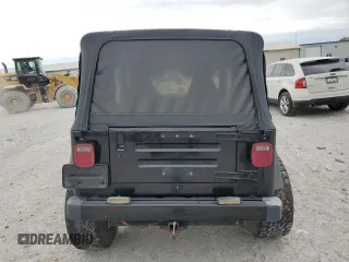 2000 Jeep Wrangler Sport with VIN 1J4FA49S9YP743515, listed as a Copart auction lot 53906305 with 247,349 mi miles and Salvage title. Bid and sale history available at DreamBid. Image 6.