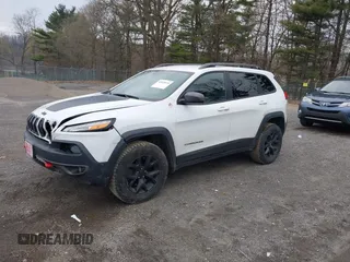 2016 Jeep Cherokee Trailhawk with VIN 1C4PJMBS7GW241076, listed as a IAAI auction lot 42020124 with 151,742 mi miles and . Bid and sale history available at DreamBid. Image 2.