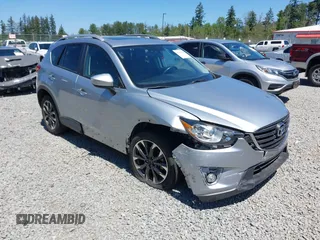 2016 Mazda CX-5 Grand Touring z VIN JM3KE4DYXG0789924, wystawiony jako IAAI lot #42358978 z przebiegiem 37 566 mil mil oraz . Historia ofert i sprzedaży dostępna na DreamBid. Obrazek 1.