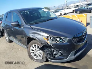 2014 Mazda CX-5 Touring z VIN JM3KE2CY8E0411832, wystawiony jako IAAI lot #42327969 z przebiegiem 88 428 mil mil oraz . Historia ofert i sprzedaży dostępna na DreamBid. Obrazek 1.