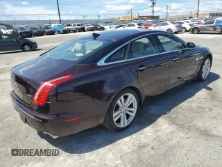 2014 Jaguar XJ with VIN SAJWA1CZ3E8V69877, listed as a Copart auction lot 51520405 with 57,567 mi miles and Clean Title. Bid and sale history available at DreamBid. Image 3.