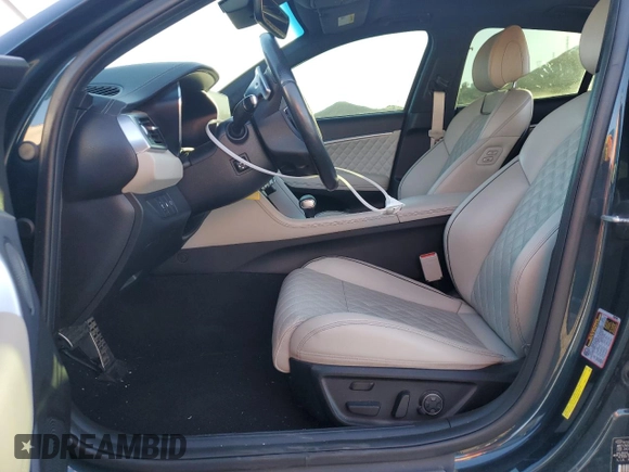 2023 Genesis G70 3.3T with VIN KMTG54TE1PU106881, listed as a Copart auction lot 83988384 with 70,698 mi miles and Salvage Title. Bid and sale history available at DreamBid. Image 7.