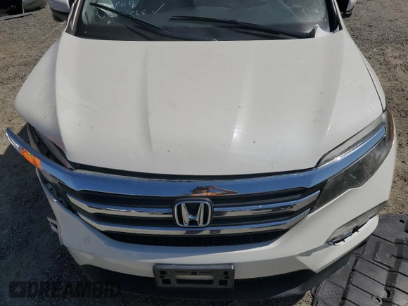 2018 Honda Pilot EX-L with VIN 5FNYF6H54JB013986, listed as a Copart auction lot 60743165 with 124,373 mi miles and Salvage title. Bid and sale history available at DreamBid. Image 12.