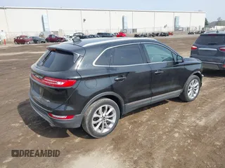 2015 Lincoln MKC with VIN 5LMTJ2AH0FUJ04461, listed as a IAAI auction lot 41804169 with 97,187 mi miles. Bid and sale history available at carsss.com. Image 4.