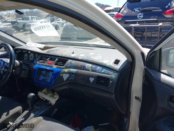 2002 Mitsubishi Lancer OZ-Rally with VIN JA3AJ86E42U039140, listed as a IAAI auction lot 41853888 with 328,181 mi miles. Bid and sale history available at carsss.com. Image 5.
