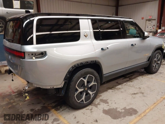 2024 Rivian R1S Adventure with VIN 7PDSGABA9RN039601, listed as a IAAI auction lot 40862472 with 6,186 mi miles. Bid and sale history available at carsss.com. Image 4.