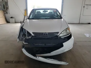 2002 Toyota Camry LE z VIN 4T1BE32K82U108626, wystawiony jako Copart lot #59215024 z przebiegiem Nie podano mil oraz Szkoda całkowita • Salvage title. Historia ofert i sprzedaży dostępna na DreamBid. Obrazek 5.