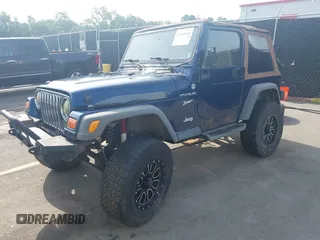 2002 Jeep Wrangler Sport with VIN 1J4FA49S72P729703, listed as a IAAI auction lot 42468446 with 164,342 mi miles and . Bid and sale history available at DreamBid. Image 2.