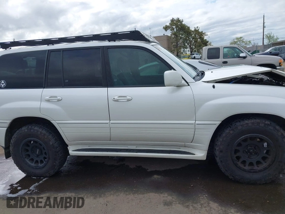 2004 Lexus LX 470 z VIN JTJHT00W043543915, wystawiony jako IAAI lot #41902858 z przebiegiem 110 454 mil mil oraz . Historia ofert i sprzedaży dostępna na DreamBid. Obrazek 14.
