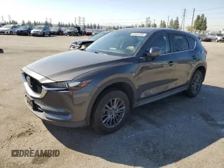 2020 Mazda CX-5 Touring with VIN JM3KFACM9L0815692, listed as a Copart auction lot 52431295 with 59,359 mi miles and Salvage Title. Bid and sale history available at DreamBid. Image 1.