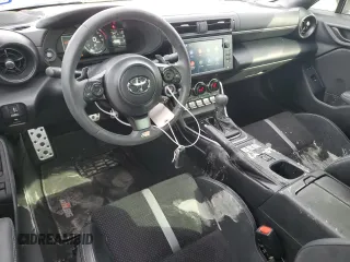 2024 Toyota GR86 Premium with VIN JF1ZNBE14R8751967, listed as a Copart auction lot 77031504 with 5,866 mi miles and Salvage Title. Bid and sale history available at carsss.com. Image 8.