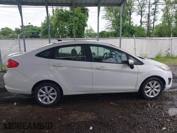 2011 Ford Fiesta SE z VIN 3FADP4BJ5BM207676, wystawiony jako IAAI lot #42263307 z przebiegiem 139 929 mil mil oraz . Historia ofert i sprzedaży dostępna na DreamBid. Obrazek 13.