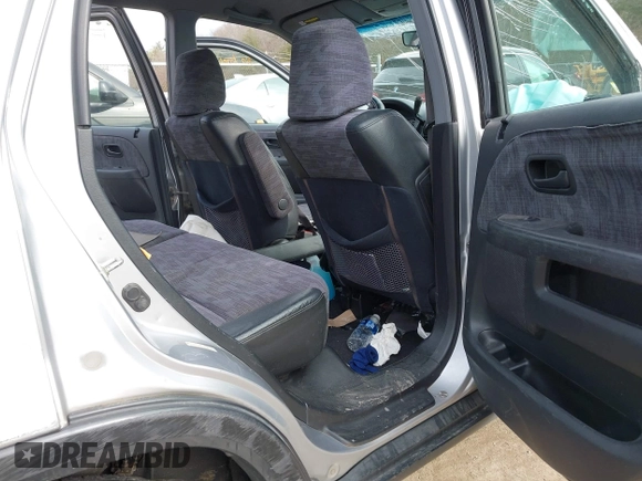2002 Honda CR-V LX z VIN JHLRD78532C050707, wystawiony jako IAAI lot #41704967 z przebiegiem 306 564 mil mil oraz . Historia ofert i sprzedaży dostępna na DreamBid. Obrazek 8.