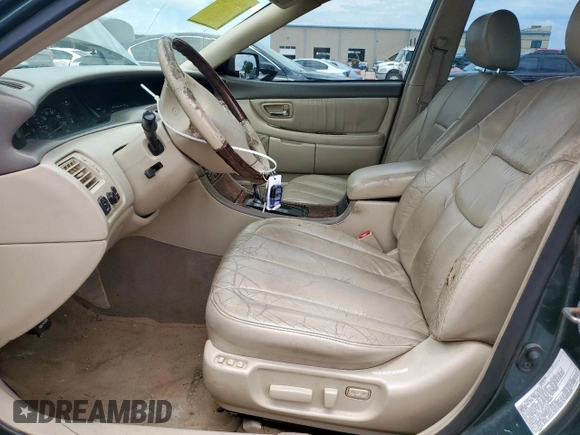 2003 Toyota Avalon XL z VIN 4T1BF28BX3U310285, wystawiony jako Copart lot #57664375 z przebiegiem 179 727 mil mil oraz Szkoda całkowita • Salvage title. Historia ofert i sprzedaży dostępna na DreamBid. Obrazek 7.