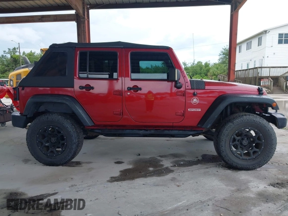 2012 Jeep Wrangler Unlimited Sport z VIN 1C4BJWDG3CL207291, wystawiony jako IAAI lot #42211454 z przebiegiem 110 864 mil mil oraz . Historia ofert i sprzedaży dostępna na DreamBid. Obrazek 14.
