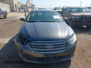 2015 Ford Taurus SEL z VIN 1FAHP2E80FG143819, wystawiony jako IAAI lot #42316114 z przebiegiem 103 959 mil mil oraz . Historia ofert i sprzedaży dostępna na DreamBid. Obrazek 12.