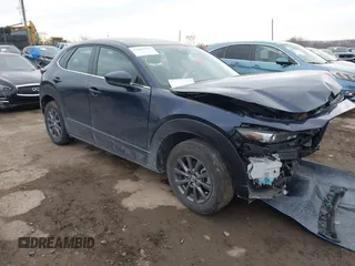 2022 Mazda CX-30 S with VIN 3MVDMBAL8NM411739, listed as a IAAI auction lot 41668265 with 34,964 mi miles and . Bid and sale history available at carsss.com. Image 1.