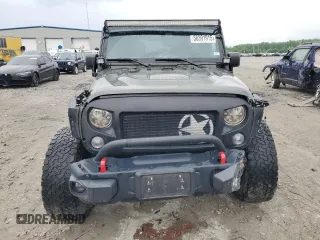 2015 Jeep Wrangler Unlimited Rubicon Hard Rock z VIN 1C4HJWFG8FL681796, wystawiony jako Copart lot #56391915 z przebiegiem 74 529 mil mil oraz Szkoda całkowita • Salvage title. Historia ofert i sprzedaży dostępna na DreamBid. Obrazek 5.