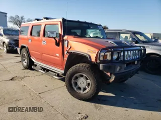 2004 Hummer H2 with VIN 5GRGN23U24H101928, listed as a Copart auction lot 86820104 with 197,079 mi miles and Salvage Title. Bid and sale history available at carsss.com. Image 4.