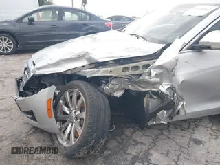 2018 Cadillac ATS Luxury RWD z VIN 1G6AB5RX6J0110860, wystawiony jako IAAI lot #41556662 z przebiegiem 63 886 mil mil oraz . Historia ofert i sprzedaży dostępna na DreamBid. Obrazek 12.