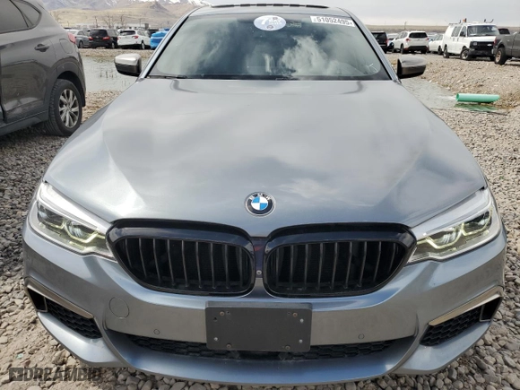 2018 BMW 5 Series M550i xDrive with VIN WBAJB9C51JB034980, listed as a Copart auction lot 51052495 with 55,705 mi miles and Clean Title. Bid and sale history available at carsss.com. Image 5.