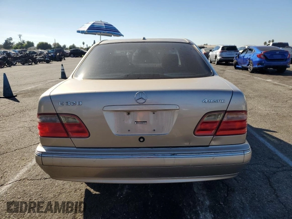 2000 Mercedes-Benz E-Class AWD with VIN WDBJF82G0YX029026, listed as a Copart auction lot 78106604 with 134,482 mi miles and Salvage Title. Bid and sale history available at carsss.com. Image 6.