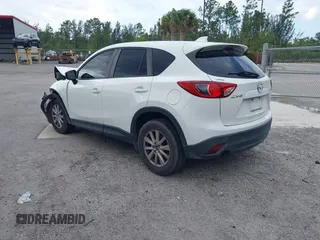 2015 Mazda CX-5 Touring with VIN JM3KE2CY8F0545967, listed as a IAAI auction lot 41909920 with 101,781 mi miles. Bid and sale history available at carsss.com. Image 3.