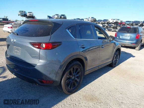2021 Mazda CX-5 Touring with VIN JM3KFACM1M0371354, listed as a IAAI auction lot 40938490 with 56,172 mi miles. Bid and sale history available at carsss.com. Image 4.