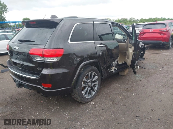 2017 Jeep Grand Cherokee Overland z VIN 1C4RJFCG7HC800403, wystawiony jako IAAI lot #42309664 z przebiegiem 98 389 mil mil oraz . Historia ofert i sprzedaży dostępna na DreamBid. Obrazek 4.