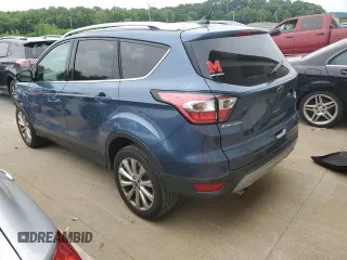 2018 Ford Escape Titanium with VIN 1FMCU9J93JUC01903, listed as a Copart auction lot 57337045 with 59,276 mi miles and Salvage title. Bid and sale history available at DreamBid. Image 2.
