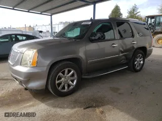 2012 GMC Yukon Denali with VIN 1GKS1EEFXCR236823, listed as a Copart auction lot 49830405 with 134,568 mi miles and Salvage Title. Bid and sale history available at carsss.com. Image 1.