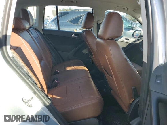 2014 Volkswagen Tiguan SE z VIN WVGAV3AX9EW563907, wystawiony jako Copart lot #45157495 z przebiegiem 100 174 mil mil oraz Szkoda całkowita • Salvage title. Historia ofert i sprzedaży dostępna na DreamBid. Obrazek 11.