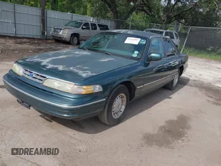 1995 Ford Crown Victoria LX с VIN 2FALP74W9SX120258, выставлен на аукционе IAAI как лот 42414057 с пробегом 210 215 миль миль и . История ставок и продаж доступна на DreamBid. Изображение 2.