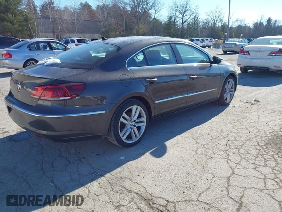 2013 Volkswagen CC Lux with VIN WVWRP7ANXDE522469, listed as a IAAI auction lot 41413025 with 115,117 mi miles. Bid and sale history available at carsss.com. Image 4.