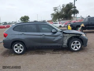 2013 BMW X1 28i with VIN WBAVM1C51DVW42577, listed as a IAAI auction lot 42029627 with 140,343 mi miles. Bid and sale history available at carsss.com. Image 14.