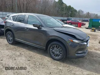 2017 Mazda CX-5 Touring with VIN JM3KFACLXH0125819, listed as a IAAI auction lot 41687038 with 101,769 mi miles. Bid and sale history available at carsss.com. Image 1.