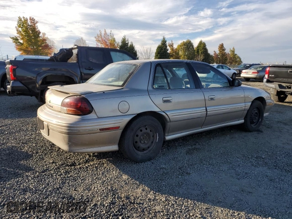 1996 Pontiac Grand Am SE2 with VIN 1G2NE52T3TC834038, listed as a Copart auction lot 76610794 with 140,379 mi miles and Salvage Title. Bid and sale history available at carsss.com. Image 3.